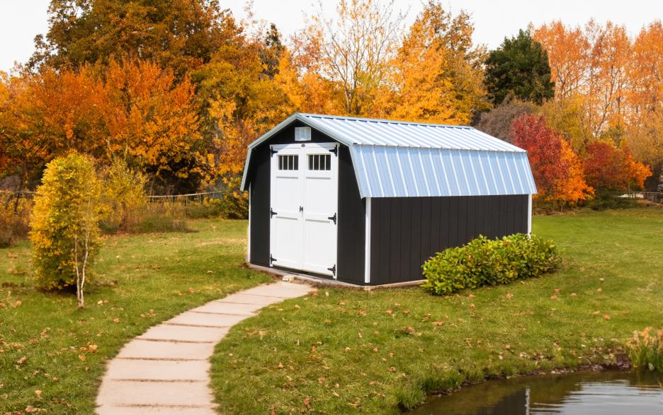 Compass Mini Barn: black LP barn siding, double doors, barn white trim and galvalume metal roofing.