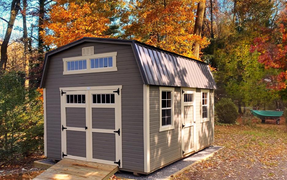 Signature High Barn: clay dutchlap siding with double doors, navajo white trim and clay roofing.